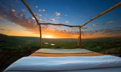 Outdoor bed with stunning view of green countryside
