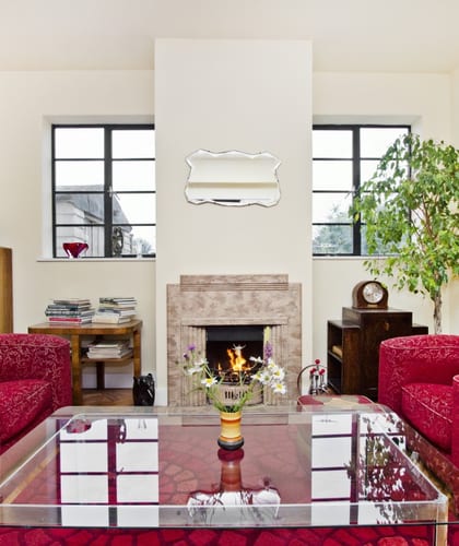 Art deco living room with two sofas, fireplace, coffee table and breakfast bar