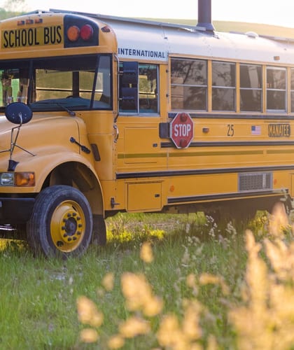 Yellow American School Bus converted into holiday accommodation in the countryside of the South Downs