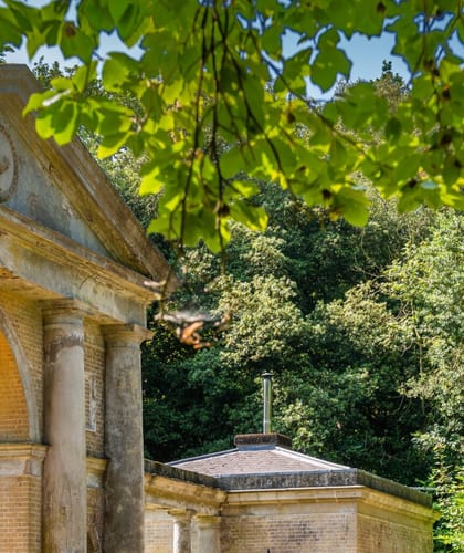 Brick and sandstone entrance archway to Palmers Folly a Grade II-listed building on Holkham Estate, Norfolk.