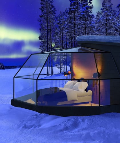 Arctic Fox Igloo in Finland at night with northern lights in sky