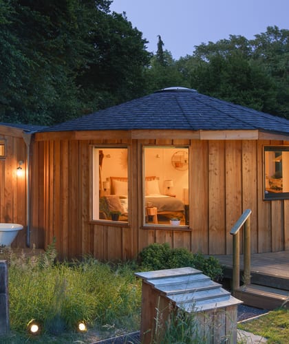 Handcrafted wooden roundhouse in Somerset farmland